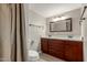 Updated bathroom features a double sink vanity, a decorative mirror, and modern fixtures at 8103 E Southern #303 Ave, Mesa, AZ 85209