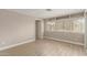 Bedroom with built-in shelves, natural light, and wood-look flooring at 8103 E Southern #303 Ave, Mesa, AZ 85209