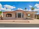 Charming home featuring low maintenance landscaping and covered parking on a sunny day at 8103 E Southern #303 Ave, Mesa, AZ 85209