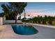 Inviting pool area with lounge chairs, an umbrella, and lush greenery at 8403 E Fairmount Ave, Scottsdale, AZ 85251