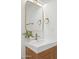 Bathroom vanity features a modern square sink, gold fixtures, and a wooden cabinet base at 8403 E Fairmount Ave, Scottsdale, AZ 85251
