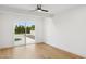 Bright bedroom featuring a large glass sliding door with a view of the pool at 8403 E Fairmount Ave, Scottsdale, AZ 85251
