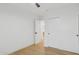 Bright, minimalist bedroom with wood flooring and sliding door closet at 8403 E Fairmount Ave, Scottsdale, AZ 85251