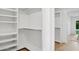 Bright, organized closet featuring built-in shelving and ample storage space at 8403 E Fairmount Ave, Scottsdale, AZ 85251
