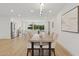 Open-concept dining area with modern decor and access to the kitchen, great for entertaining and Gathering gatherings at 8403 E Fairmount Ave, Scottsdale, AZ 85251