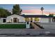 Charming home boasts fresh landscaping, updated lighting fixtures, and a well-manicured front yard at 8403 E Fairmount Ave, Scottsdale, AZ 85251