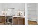 New kitchen with stainless steel oven, white countertops, and a walk-in pantry at 8403 E Fairmount Ave, Scottsdale, AZ 85251