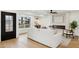 Bright living space featuring stylish furniture, a modern fireplace, and a seamless flow to the outdoors at 8403 E Fairmount Ave, Scottsdale, AZ 85251