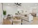 Elegant living room features a ceiling fan and neutral tones, creating a cozy and inviting atmosphere at 8403 E Fairmount Ave, Scottsdale, AZ 85251