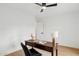 Clean office featuring wood desk, ceiling fan, and ample light at 8403 E Fairmount Ave, Scottsdale, AZ 85251