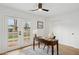 Bright office with desk, ceiling fan, French doors, and natural light at 8403 E Fairmount Ave, Scottsdale, AZ 85251