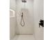 Modern walk-in shower with rainfall showerhead and sleek black fixtures at 8403 E Fairmount Ave, Scottsdale, AZ 85251