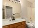 Bright bathroom featuring a tub, shower, and ample counter space at 8628 W Maui Ln, Peoria, AZ 85381