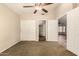 Spacious bedroom with ceiling fan, offering closet space, and backyard access at 8628 W Maui Ln, Peoria, AZ 85381