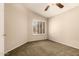 Cozy bedroom with natural light, ceiling fan, and neutral color palette at 8628 W Maui Ln, Peoria, AZ 85381