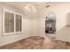 Inviting dining area with plantation shutters, tile flooring, and stylish lighting at 8628 W Maui Ln, Peoria, AZ 85381
