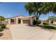Beautiful single-story home featuring a well-kept lawn and extended driveway at 8628 W Maui Ln, Peoria, AZ 85381