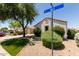 Landscaped home exterior on a corner with rock landscaping and manicured bushes at 8628 W Maui Ln, Peoria, AZ 85381
