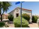 Close up exterior of a home with rock landscaping and bushes at 8628 W Maui Ln, Peoria, AZ 85381