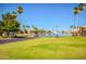 Lakeside park featuring well-maintained green spaces, picnic tables, and easy access to the water at 8628 W Maui Ln, Peoria, AZ 85381