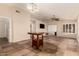 Spacious room featuring tile flooring, ceiling fan, and bright lighting at 8628 W Maui Ln, Peoria, AZ 85381