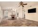 Spacious open living area with decorative tile flooring, ceiling fan and multiple entry points at 8628 W Maui Ln, Peoria, AZ 85381