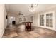 Open-concept living space featuring tile flooring, ceiling fan, and plenty of natural light at 8628 W Maui Ln, Peoria, AZ 85381