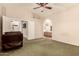 Serene bedroom featuring a ceiling fan and connecting doors to ensuite bathroom at 8628 W Maui Ln, Peoria, AZ 85381
