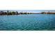Picturesque waterfront view features calm blue water and houses along the canal at 8628 W Maui Ln, Peoria, AZ 85381