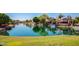 Picturesque view of waterfront properties with lush greenery and private docks on the canal at 8628 W Maui Ln, Peoria, AZ 85381