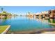 Scenic view of waterfront homes with boats docked along the tranquil canal at 8628 W Maui Ln, Peoria, AZ 85381