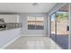 Bright dining area with sliding glass doors leading to the backyard, enhancing indoor-outdoor living at 8750 W Granada Rd, Phoenix, AZ 85037