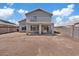 Back of the house featuring a balcony, windows for natural light, and a cozy patio at 8750 W Granada Rd, Phoenix, AZ 85037