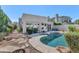 Private backyard with a sparkling pool, lush greenery, and a serene setting for relaxation and entertainment at 8760 N 73Rd Way, Scottsdale, AZ 85258