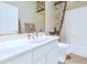 Bathroom with white cabinets, a large mirror, and a shower/tub combo at 8760 N 73Rd Way, Scottsdale, AZ 85258