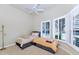 Bedroom with two twin beds, storage drawers, and plantation shutters at 8760 N 73Rd Way, Scottsdale, AZ 85258