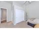 Bedroom featuring neutral carpet, storage, and a closet with sliding doors at 8760 N 73Rd Way, Scottsdale, AZ 85258