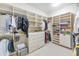 Walk-in closet with custom shelving, drawers, and ample storage space at 8760 N 73Rd Way, Scottsdale, AZ 85258