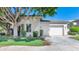 Charming single-story home with mature tree, well-manicured lawn, and a two-car garage in a desirable neighborhood at 8760 N 73Rd Way, Scottsdale, AZ 85258