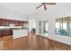 Open concept living area with updated kitchen, stainless appliances and wood floors throughout at 8760 N 73Rd Way, Scottsdale, AZ 85258