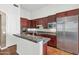Well-equipped kitchen features stainless steel appliances, a center island and modern finishes at 8760 N 73Rd Way, Scottsdale, AZ 85258