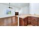 Open-concept living space with wood floors, fireplace, wet bar and lots of natural light at 8760 N 73Rd Way, Scottsdale, AZ 85258
