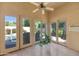 Relax in this covered patio with views of the pool and lush landscaping, perfect for outdoor lounging at 8760 N 73Rd Way, Scottsdale, AZ 85258