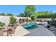 The backyard oasis includes a sparkling pool and spa surrounded by lush landscaping, offering a private retreat at 8760 N 73Rd Way, Scottsdale, AZ 85258