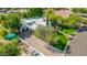 Expansive home aerial view showcasing mature landscaping, brick driveway, and white exterior at 9310 S Bala Dr, Tempe, AZ 85284