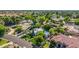 Aerial view of a charming home with mature trees, lush landscaping, and manicured lawn at 9310 S Bala Dr, Tempe, AZ 85284
