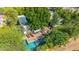 Aerial view of a home with mature trees, a sparkling pool, patio area, and lush backyard landscaping at 9310 S Bala Dr, Tempe, AZ 85284