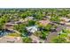 Aerial view of a lovely home with mature trees, lush landscaping, and circular driveway at 9310 S Bala Dr, Tempe, AZ 85284