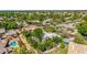 Aerial view showing manicured landscaping, mature trees, and white exterior at 9310 S Bala Dr, Tempe, AZ 85284