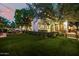 Enjoy this backyard with an artificial lawn, ambient string lights, and outdoor furniture; great for gatherings at 9310 S Bala Dr, Tempe, AZ 85284